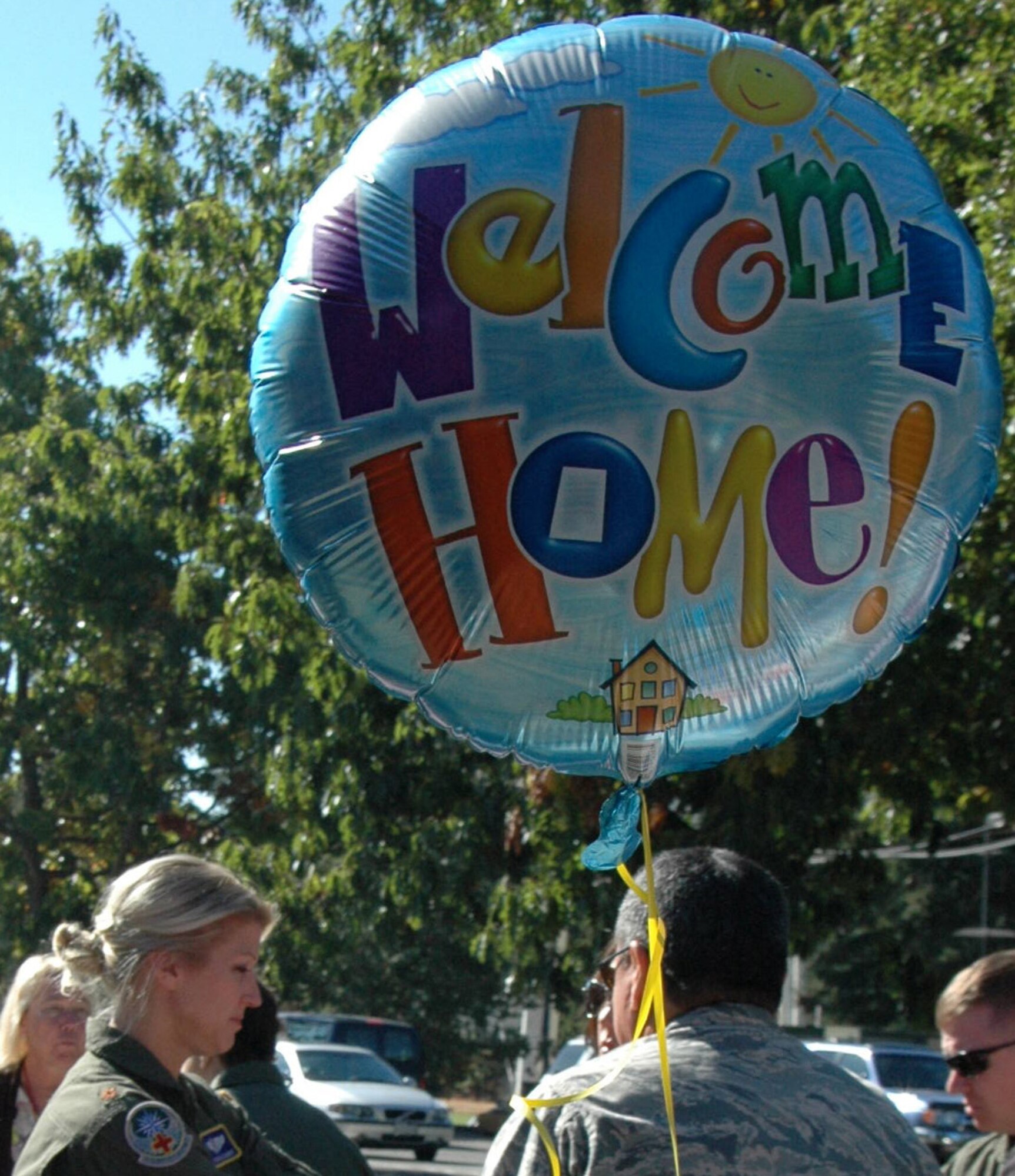 Reservists with the 446th Aeromedical Evacuation Squadron out of McChord Field, Wash., are welcomed back home, Oct. 3, after being deployed from numerous locations around the world. About 30 flight nurses, Medical Service Corps officers, and flight medics had been supporting Operation Enduring Freedom since April. (U.S. Air Force photo by Sandra Pishner) 