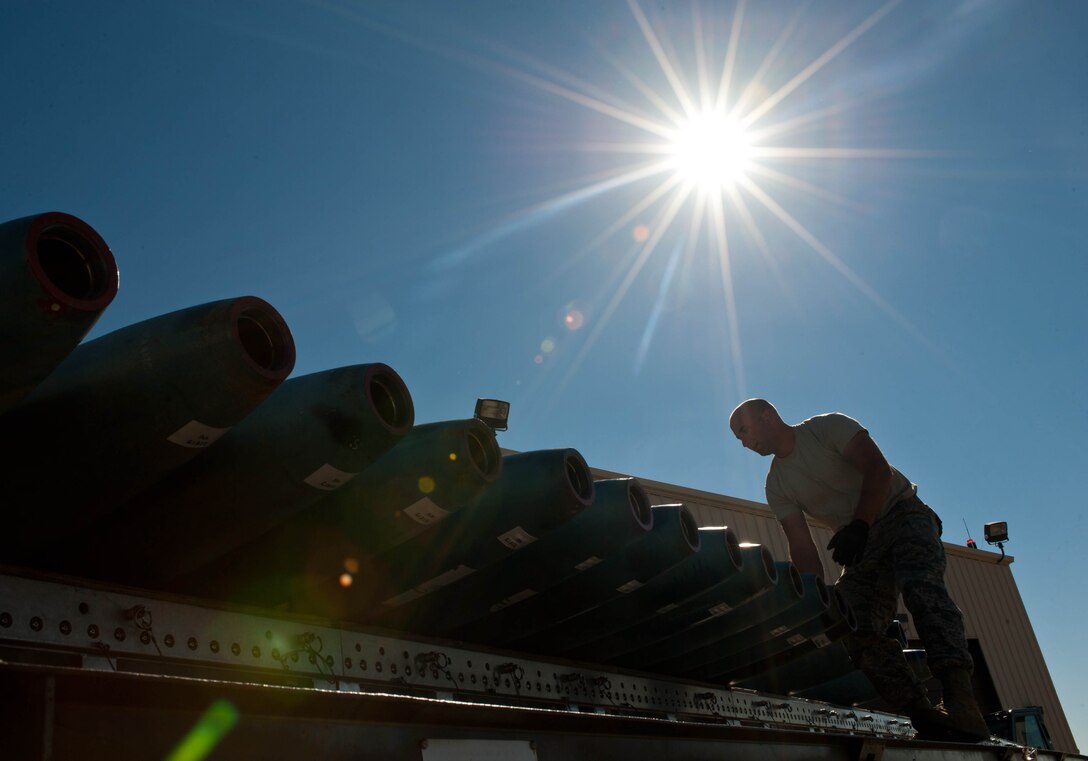Staff Sgt. Joshua Gott, 28th Munitions Squadron line crewmember, secures guided bomb units to a load trailer during the Global Strike Challenge at Ellsworth Air Force Base, S.D., Oct. 1, 2012. Competitors were scored on a variety of activities tied to munitions including weapons handling, assembly operations, standards and policies, skills knowledge and dress and appearance. (U.S. Air Force photo by Airman 1st Class Zachary Hada/Released)