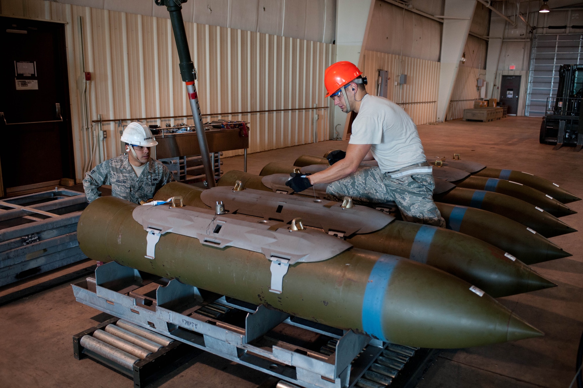 Staff Sgts. Anthony Anderson , and Joshua Gott, 28th Munitions Squadron line crew chiefs, assemble munitions during the Global Strike challenge at Ellsworth Air Force Base, S.D., Oct. 1, 2012. The Global Strike Challenge pits bomber, intercontinental ballistic missile and security forces teams from across the Air Force community against one another to improve combat capabilities and foster espirt de corps through competition and teamwork. (U.S. Air Force photo by Airman 1st Class Zachary Hada/Released)