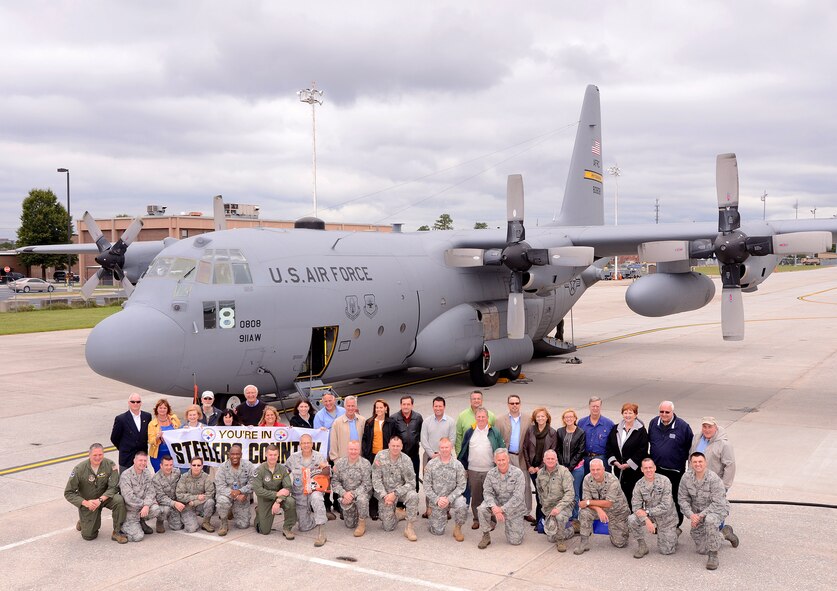 The Greater Pittsburgh Honorary Commanders Association poses for a group photo shortly after arriving at Dobbins Air Reserve Base in the C-130H from the 911th Airlift Wing at Pittsburgh IAP Air Reserve Station on Oct. 2.   The members of the HCA came to Dobbins to better familiarize themselves with different aspects of the military.  (U.S. Air Force photo/Brad Fallin)