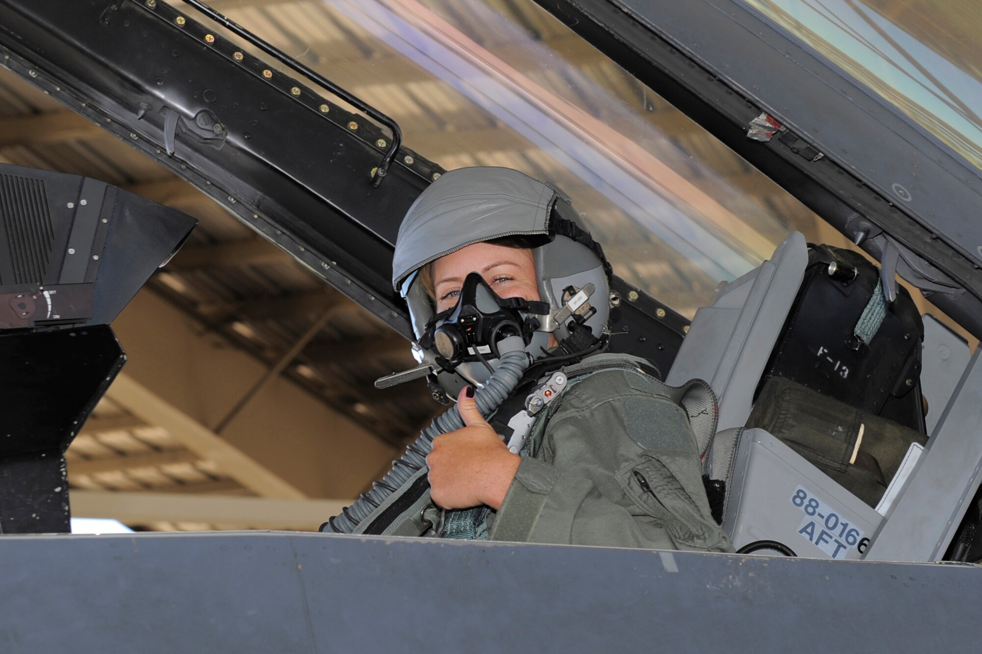 Brittany Lincicome, LPGA Tour professional golfer, sits in the backseat of an F-16 Fighting Falcon Oct. 2 at Hill Air Force Base, Utah. Lincicome visited the Air Force base Oct. 1-2 to  support a charity golf event and fly in an F-16. (Todd Cromar/U.S. Air Force)
