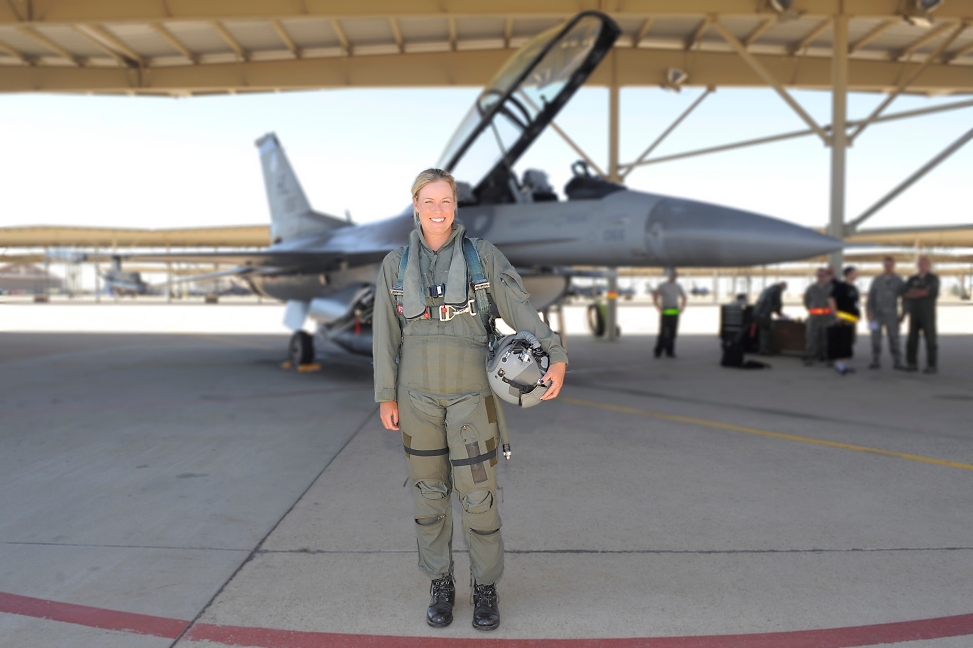 Brittany Lincicome, LPGA Tour professional golfer, stands in front of an F-16 Fighting Falcon Oct. 2 at Hill Air Force Base, Utah. Lincicome visited the Air Force base Oct. 1-2 to support a charity golf event and fly in an F-16. (Todd Cromar/U.S. Air Force)
