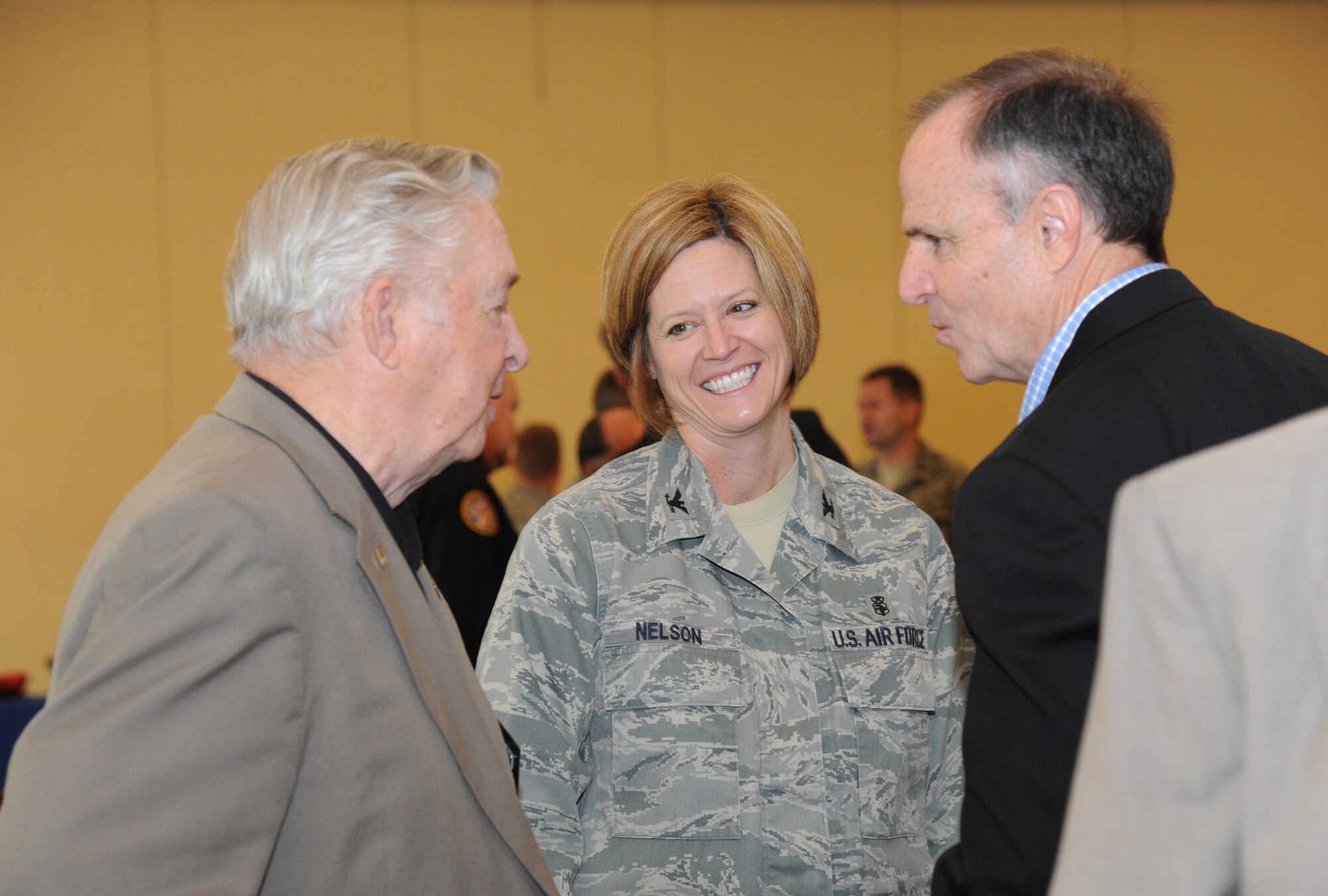 Don McCormick, Keesler Federal Credit Union director emeritus, Col. Cathy Nelson, 81st Medical Group deputy commander, and John Goff, KFCU CEO, socialize following the Biloxi Chamber of Commerce Morning Call Sept. 4, 2012, hosted by Keesler Air Force Base, Miss., at the Bay Breeze Event Center.  (U.S. Air Force photo by Kemberly Groue)