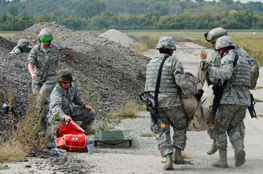 Members of the 139th Airlift Wing conduct a mock deployment scenario at Rosecrans Air National Guard Base, St. Joseph, Mo., Sept. 28, 2012. Members of the Missouri Military Preparedness and Enhancement Commission and other local civic leaders witnessed an airdrop demonstration hosted by the 139th Airlift Wing. (Missouri Air National Guard photo by Staff Sgt. Michael Crane/Released)