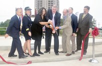 (From left) Al Dominguez, AMEDD Museum technician; Lt. Gen. Patricia Horoho, Army surgeon general and commanding general of the U.S. Army Medical Command; Maria Rocco, widow of Medal of Honor recipient Chief Warrant Officer 2 Louis R. Rocco; retired Maj. Gen. Patrick Sculley, chairman of the AMEDD Museum Foundation; retired Maj. Gen. Kenneth Farmer Jr., former Army deputy surgeon general; Scott Schoner, AMEDD Museum director; and Marc Long, vice president for business development from contractor Tetra Tech, cut the ribbon on the AMEDD Medal of Honor Walk.
Photo by Kirk Frady