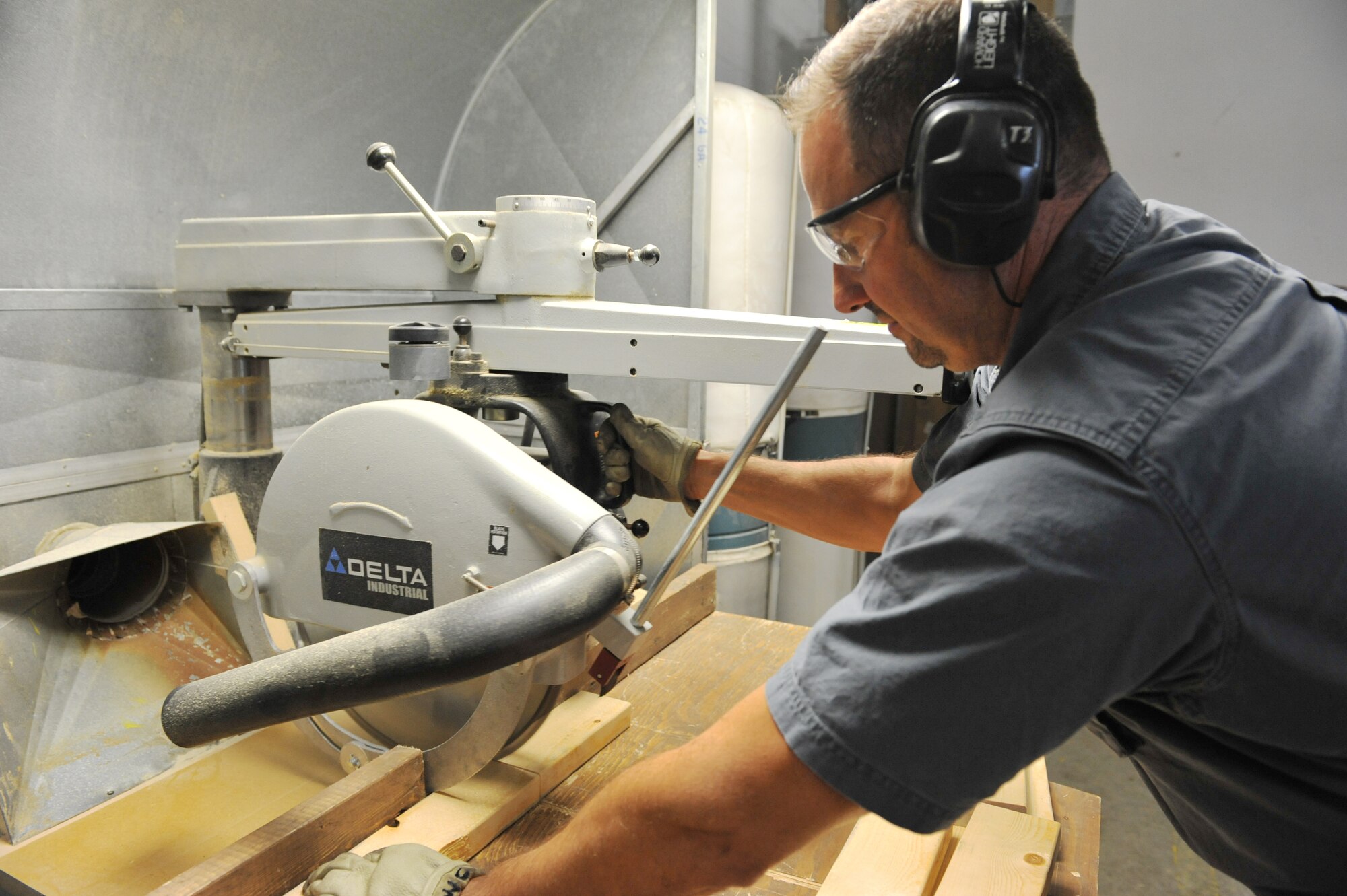 WHITEMAN AIR FORCE BASE, Mo. -- Chuck Wellman, 509th Logistics Readiness Squadron wood worker, cuts plywood to desired length according to Special Packaging Instructions at the cargo movement section of Traffic Management Office Oct. 2. Special Packaging Instructions are used for aircraft parts to be shipped out, or anything that requires special packaging. (U.S. Air Force photo/Heidi Hunt) (Released)