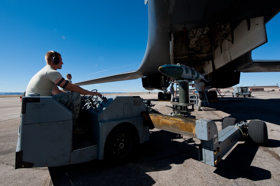 Airman 1st Class Brice Weathers, 28th Aircraft Maintenance Squadron load crew member, transports an inert Mk-82 bomb to a B-1 during the Global Strike Challenge at Ellsworth Air Force Base, S.D., Oct. 1, 2012. Ellsworth Airmen routinely train on building and loading munitions quickly and accurately, ensuring the base is able to provide expeditionary combat power for America. (U.S. Air Force photo by Airman 1st Class Kate Thornton-Maurer/Released)