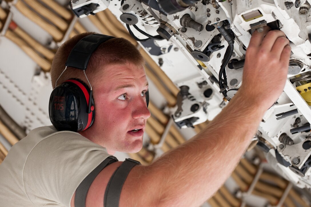 Airman 1st Class Brice Weathers, 28th Aircraft Maintenance Squadron load crew member, prepares a rotary launcher for bomb loading during the Global Strike Challenge at Ellsworth Air Force Base, S.D., Oct. 1, 2012. About 450 competitors take part in Global Strike Challenge competitions designed to evaluate security forces, bomber, missile and helicopter operations and maintenance. (U.S. Air Force photo by Airman 1st Class Kate Thornton-Maurer/Released)