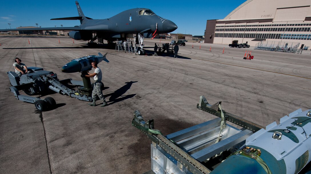 Airmen of the 28th Aircraft Maintenance Squadron are evaluated on their bomb loading speed and technique during the Global Strike Challenge at Ellsworth Air Force Base, S.D., Oct. 1, 2012. Global Strike Challenge is the world's premier competition for bomber crews, intercontinental ballistic missileers and security forces, and includes units from Air Combat Command, Air Force Global Strike Command, Air Force Reserve Command and the Air National Guard. (U.S. Air Force photo by Airman 1st Class Kate Thornton-Maurer/Released)