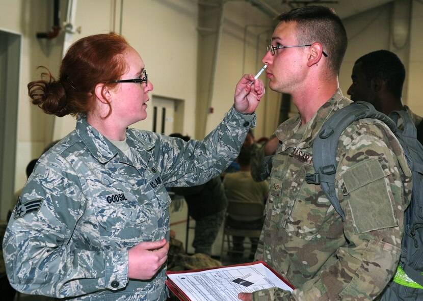 U.S. Air Force Senior Airman Ashley Godsil, 27th Special Operations Medical Group medical technician, administers flu mist to a returning Airman during Operation Homecoming at Cannon Air Force Base, N.M., Oct. 4, 2012. Operation Homecoming is a monthly event held to welcome Air Commandos back from worldwide deployments and reunite them with family and friends. (U.S. Air Force photo/Airman 1st Class Ericka Engblom)

