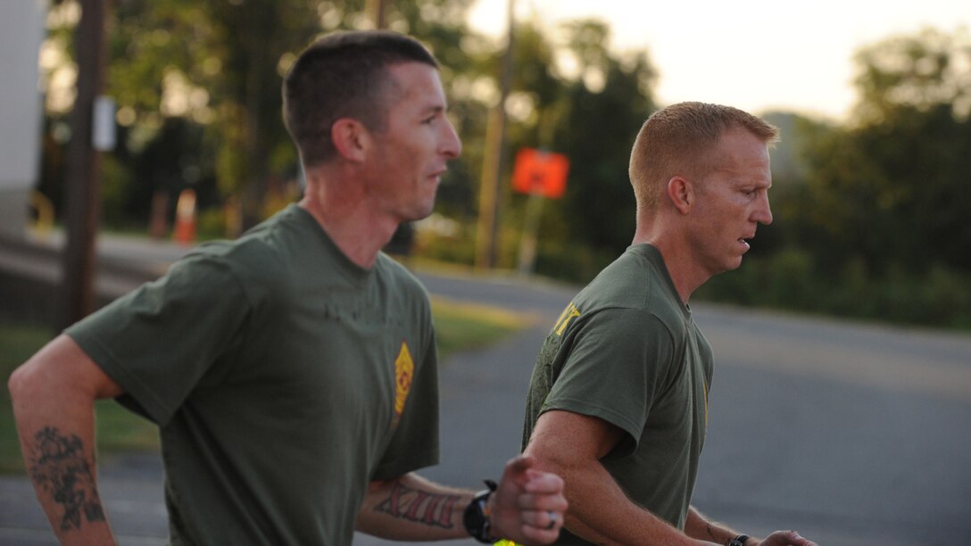 Air Force Master Sgt. Michael Noel, right, runs with a Marine during a Professional Military Education (PME) class at Quantico Marine Corp Base, Va., Sept. 14, 2012. Noel is attending the U.S. Marine Corps Staff Noncommissioned Officer Academy Advanced Course as part of a new program called EPME-Next. He is the Secretary of the Air Force Public Affairs superintendent of force management at the Pentagon. (U.S. Air Force photo/Senior Airman Christina Brownlow)