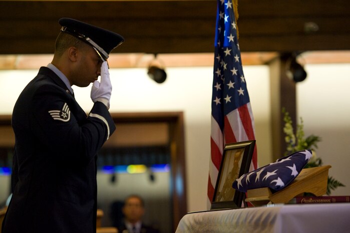 U.S. Air Force Staff Sgt. Ryan Hines, Honor Guard flight chief, renders a salute after placing a flag on Senior Airman Jimmy Rivera?s altar during a memorial service Sep. 28, 2012, at Nellis Air Force Base, Nev. The Honor Guard was on-hand to render military honors during the ceremony, which was held at Nellis as an opportunity for friends, family and coworkers to reflect on Rivera?s life and military service. (U.S. Air Force photo by Airman 1st Class Christopher Tam)