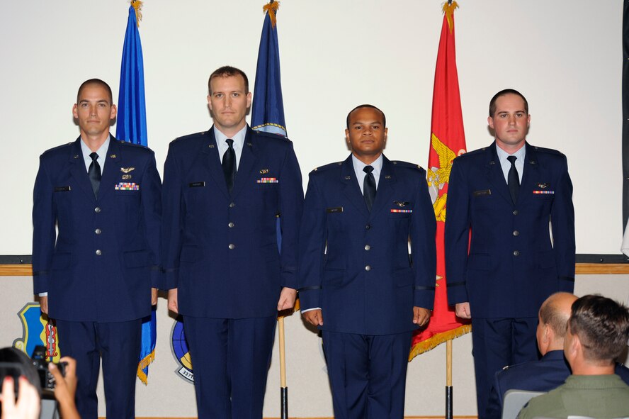 Graduate members of Air Battle Management Class 13001 pose for a celebratory photo after graduating on Oct. 3. (U.S. Air Force photo by Chris Cokeing)	