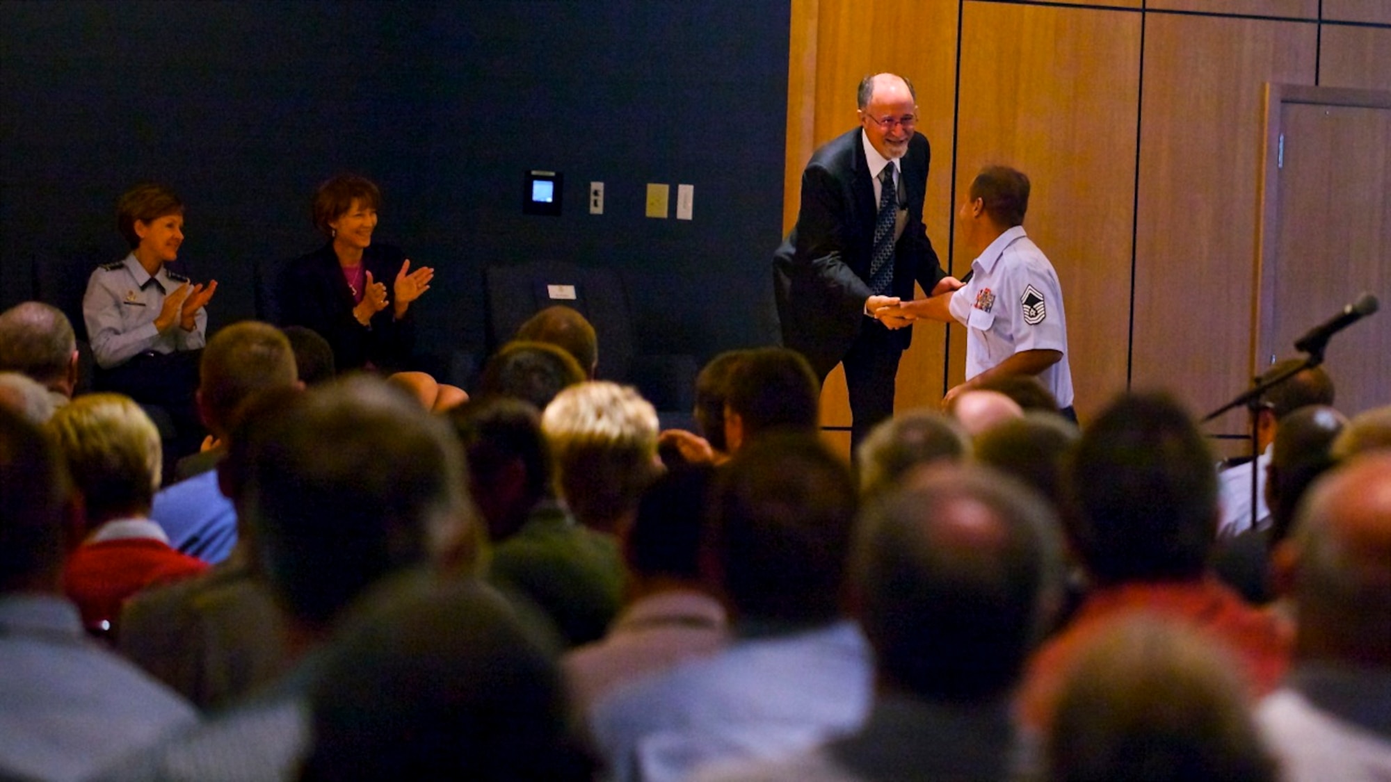 Mr. Joe Sciabica, Air Force Civil Engineer Center director, receives a warm welcome from members of the former Air Force Civil Engineer Support Agency at a town hall meeting Oct. 2 to celebrate the new AFCEC. AFCESA merged with its sister units, the Air Force Center for Engineering and the Environment and the Air Force Real Property Agency to form a new unit called the Air Force Civil Engineer Center. (U.S. Air Force courtesy photo)