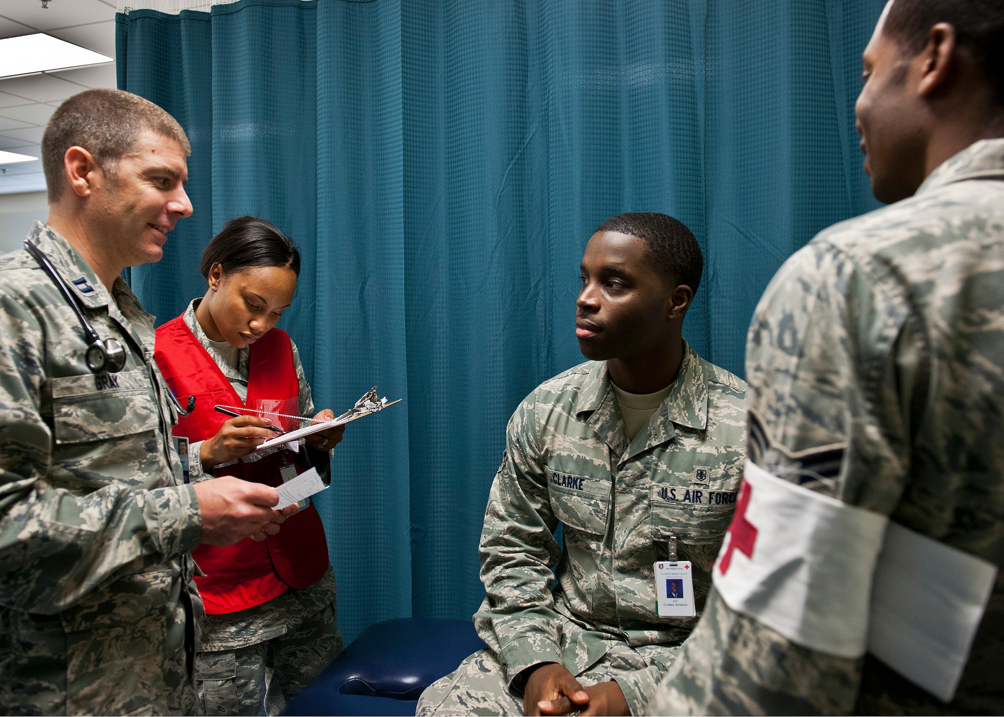 Capt. Kevin Gray, of the 96th Medical Group, talks with a simulated patient about his flu-like symptoms during a disease containment exercise at Eglin Air Force Base, Fla., Oct. 3.  The week-long exercise measured the base and specifically the 96th Medical Group’s response to a medical/biological emergency.  (U.S. Air Force photo/Samuel King Jr.)
