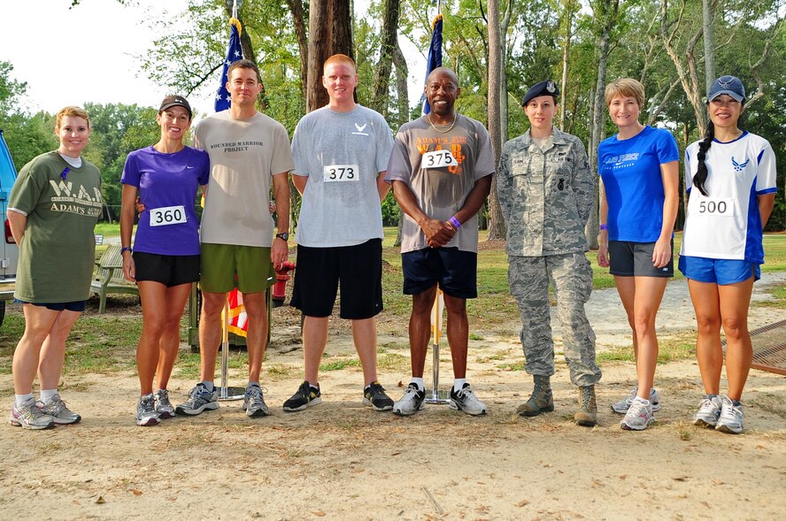 Members of Team Seymour pose for a group photo during the 4th Annual Wife Appreciation Run in Goldsboro, N.C., Sept. 29, 2012. Airmen from Seymour Johnson Air Force Base, Department of Defense civilians and family members participated in the event to support the community’s fight against domestic violence. (U.S. Air Force photo/Airman 1st Class Aubrey Robinson/Released)