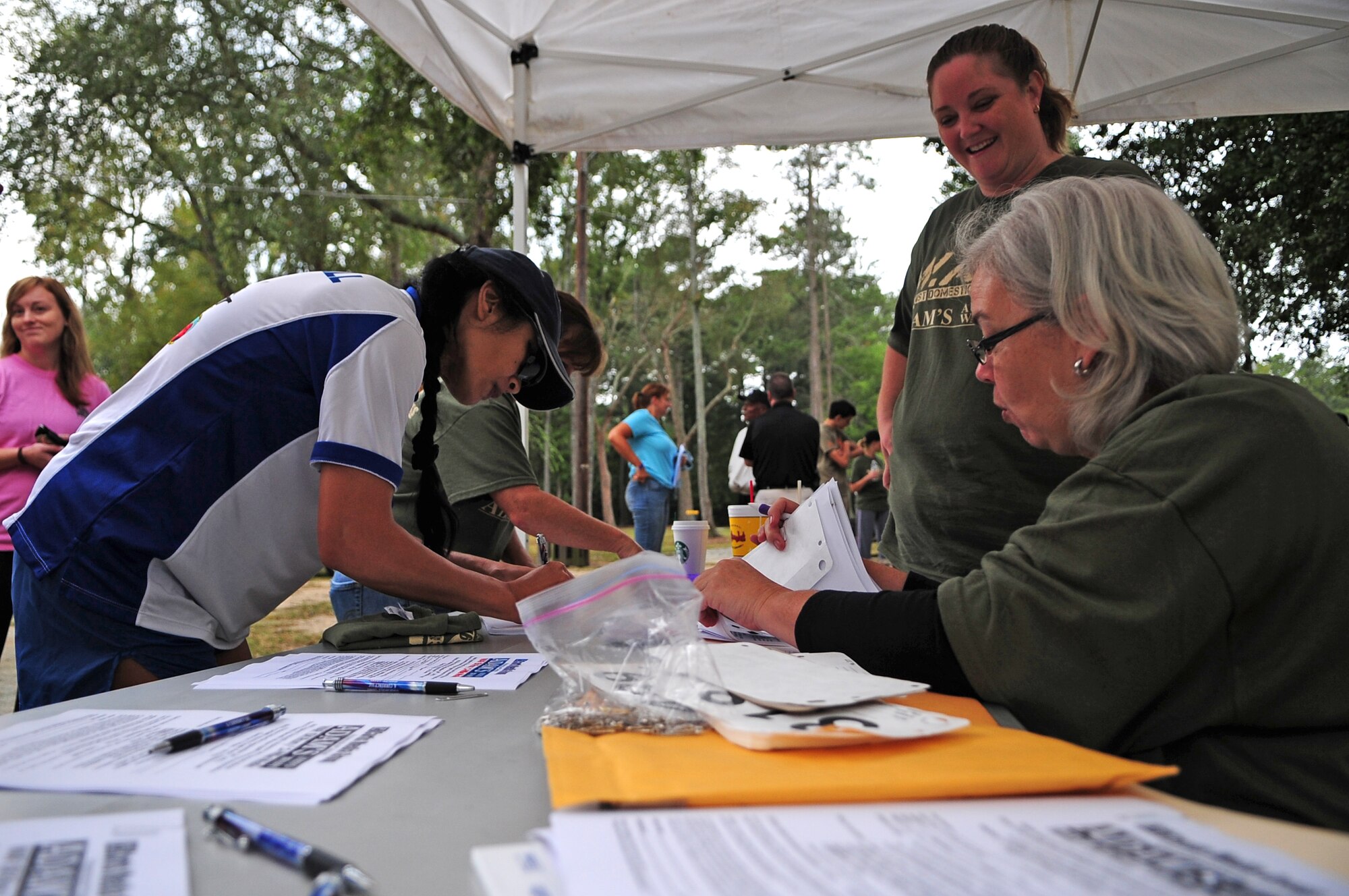 U.S. Air Force Col. Leslie Claravall, 4th Medical Group commander, registers for the 4th Annual Wife Appreciation Run in Goldsboro, N.C., Sept. 29, 2012. The 5k run and 1-mile walk was held to support the war on domestic violence. (U.S. Air Force photo/Airman 1st Class Aubrey Robinson/Released)