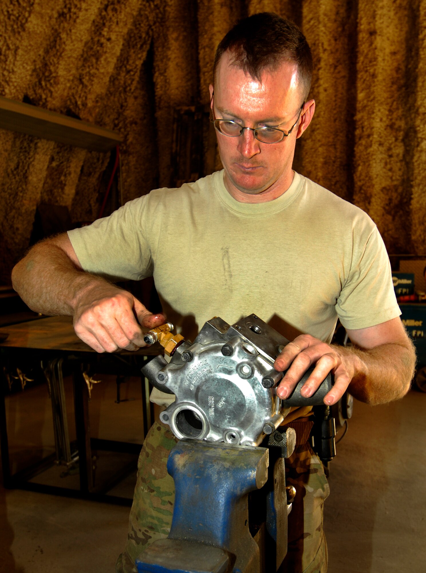 SSgt Adam Ritchie, a 455th Expeditionary Logistics Readiness Squadron Vehicle Maintenance Journeyman, replaces O-rings on a water pump for a 455th Expeditionary Security Forces Squadron Mine Resistant Ambush Protected All-Terrain Vehicle at Bagram Air Field, Afghanistan, Oct. 3, 2012. The 455th ELRS tactical vehicle maintenance team works seven days a week, keeping pace with a steady flow of mundane vehicle repairs as well as critical upgrades which further enhance the safety of Bagram’s tactical vehicle fleet. (U.S. Air Force Photo/Staff Sgt. Jeff Nevison)