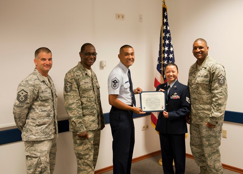 Staff Sgt. Mary Martin, 39th Communications Squadron, is presented the September 2012 Diamond Sharp Award by members of the Incirlik First Sergeant Council Oct. 4, 2012, at Incirlik Air Base, Turkey. Martin earned the monthly award by distinguishing herself through outstanding professionalism, performance and display of the Air Force core values. (U.S. Air Force photo by Senior Airman Clayton Lenhardt/Released)