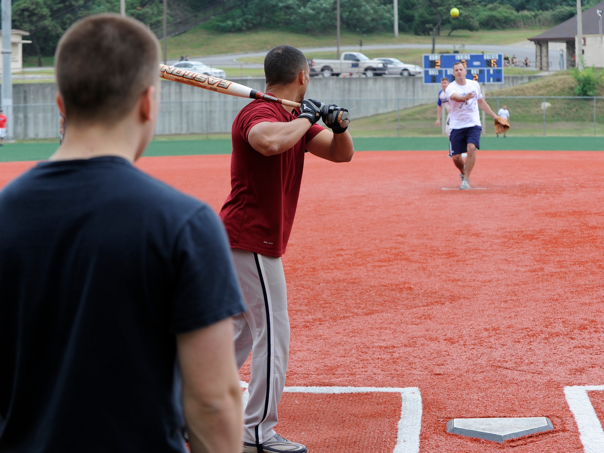 A member of the 20th Support Squadron, Daegu Army Garrison, Republic of Korea, throws the ball to a member of the 8th Fighter Wing, Kunsan Air Base, ROK during a peninsula-wide sports day at Osan Air Base, ROK, Sept. 28, 2012. Kunsan beat Daegu but lost to Osan’s 51st Fighter Wing during the championship. (U.S. Air Force photo/Senior Airman Marcus Morris)