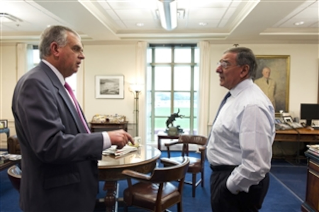 Transportation Secretary Ray LaHood, left, meets with Secretary of Defense Leon E. Panetta in his Pentagon office on Oct. 4, 2012.  