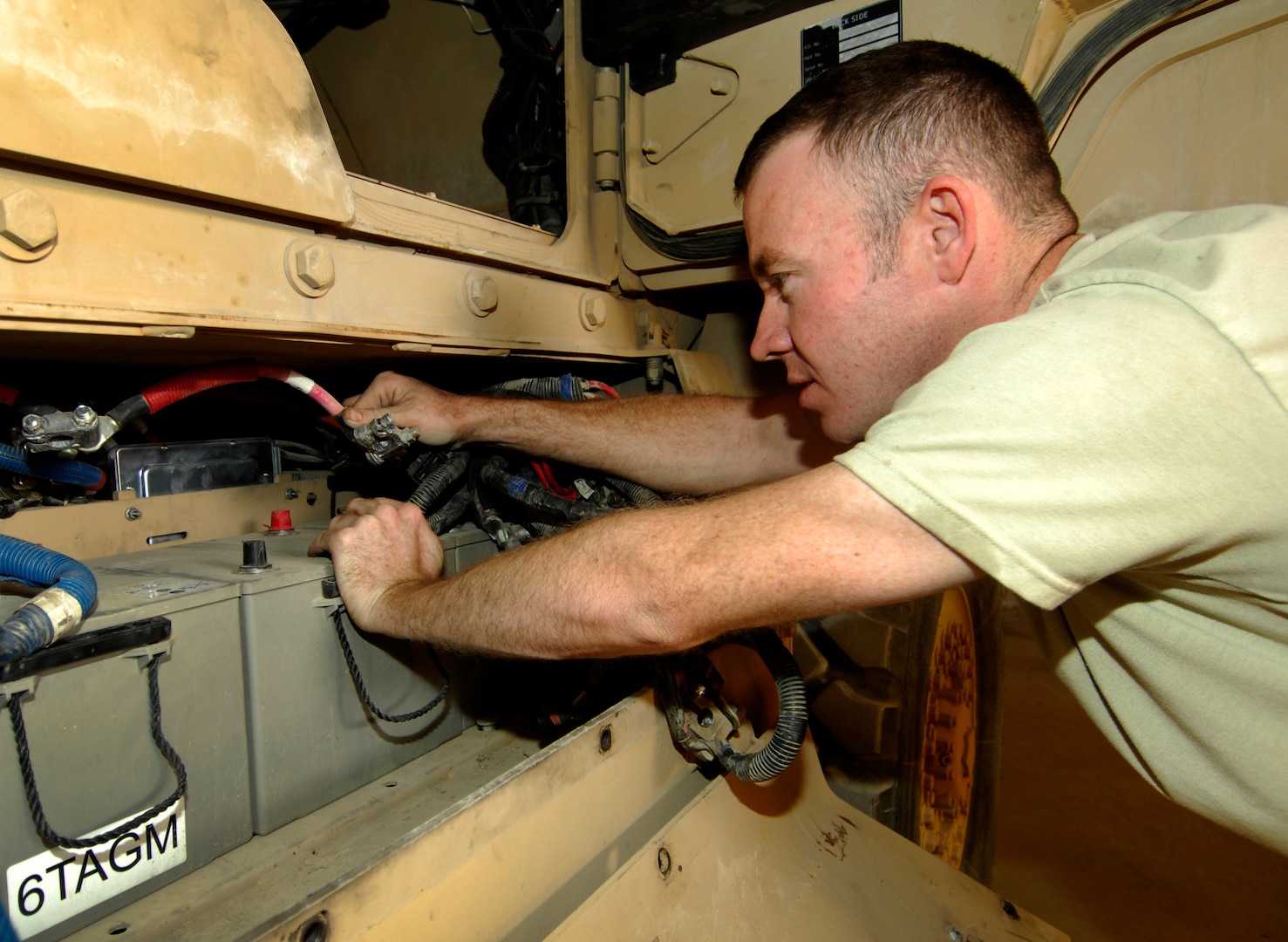SSgt Jeremy Easterwood, a 455th Expeditionary Logistics Readiness Squadron Vehicle Maintenance Journeyman, places a battery in a Mine Resistant Ambush Protected vehicle HUMVEE at Bagram Air Field, Afghanistan, Oct. 3, 2012. Over the past six months, Bagram’s fleet of tactical vehicles has logged approximately 161,000 hours of driving time, safely carrying 455th ESFS Airmen as they protect the base. This kind of mileage keeps the maintainers busy with a variety of tasks. (U.S. Air Force Photo/Staff Sgt. Jeff Nevison)