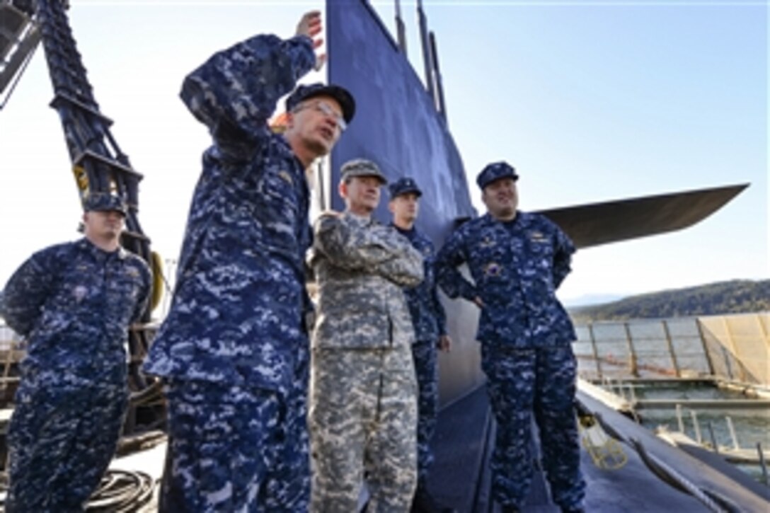 Navy Rear Adm. Robert M. Hennegan briefs  Army Gen. Martin E. Dempsey, chairman of the Joint Chiefs of Staff, aboard the USS Maine submarine at Naval Base Kitsap-Bangor in Silverdale, Wash., Oct. 3, 2012.