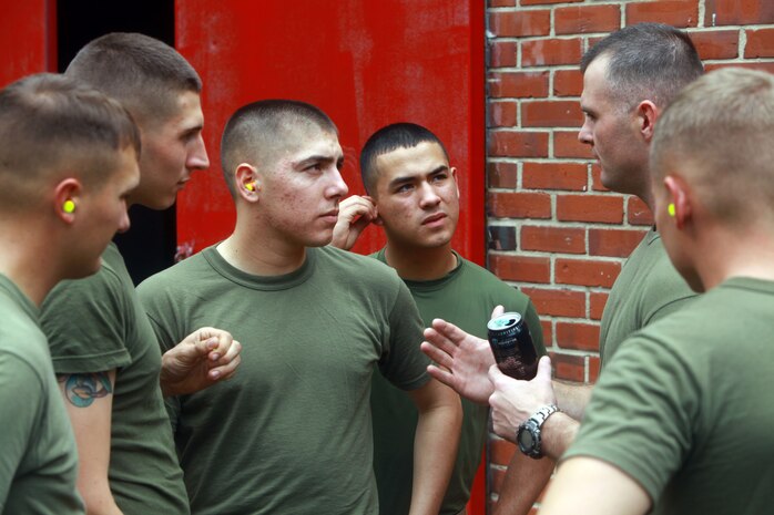 Sgt. Jason L. Stacy, a chemical, biological, radiological, nuclear defense specialist with Combat Logistics Regiment 27, 2nd Marine Logistics Group, gives Marines instructions during a training exercise aboard Camp Lejeune, N.C., Oct. 3, 2012. Troops were graded during a practical application on the new joint service transportable decontamination system, or M26, to receive certification