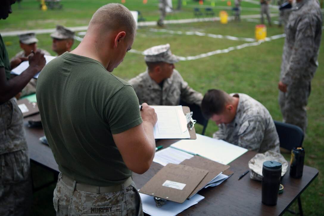 Marines with Combat Logistics Battalion 26, Combat Logistics Regiment 27, 2nd Marine Logistics Group process simulated victims during a training exercise aboard Camp Lejeune, N.C., Oct. 3, 2012. Servicemembers trained to evacuate U.S. citizens, their families and friends while in a chaotic environment. 