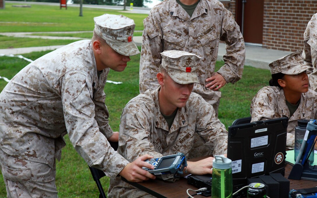 Marines with Combat Logistics Battalion 26, Combat Logistics Regiment 27, 2nd Marine Logistics Group help each other learn the embarkation process during a training exercise aboard Camp Lejeune, N.C., Oct. 3, 2012. Troops learned how to set up an evacuation control center to process U.S. families and friends in a foreign country to get them to safety. 