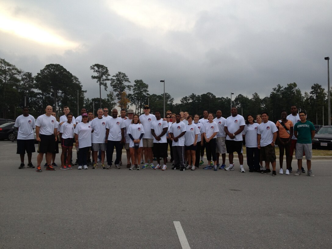 Sailors with 2nd Dental Battalion, 2nd Marine Logistics Group pose for a photo during a suicide prevention walk aboard Camp Lejeune, N.C., Sept. 29, 2012. During the three-mile walk, 45 sailors and members of the Junior Enlisted Association trotted through the streets and roads of the French Creek area of the base. (U.S. Marine Corps photo by Pvt. Franklin E. Mercado)