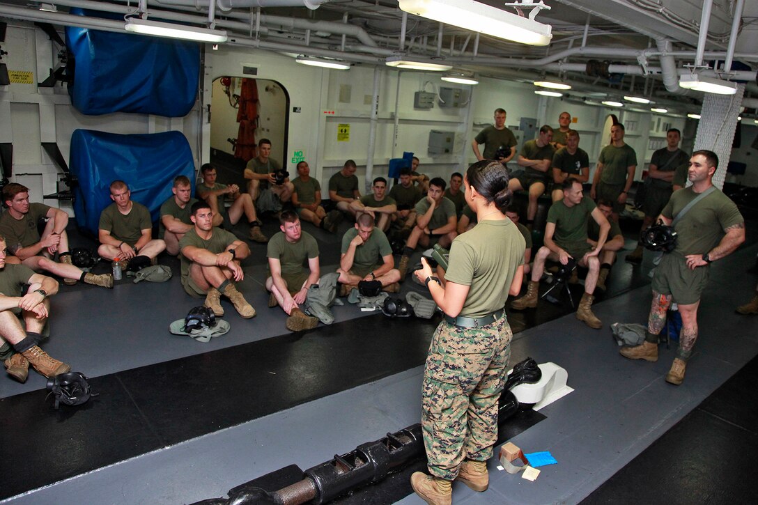 Corporal Elaine C. Romain, assessment consequence management team member, Chemical, Biological, Radiological and Nuclear Defense Platoon, 15th Marine Expeditionary Unit, gives a class to Weapons Company, Battalion Landing Team 3/5, 15th MEU, on some of the different tools CBRN Marines use to operate in contaminated environments, aboard the USS Peleliu, Oct. 4. The 15th MEU?s CBRN Defense Platoon is spending an entire month preparing the 2,400 servicemembers that make up the MEU on how to properly operate in contaminated environments. The 15th MEU is currently embarked as part of the Peleliu Amphibious Ready Group, while they serve as the nation's rapid-response sea-based Marine Air Ground Task Force for Western Pacific Deployment 12-02. Romain, 21, is from New Orleans.