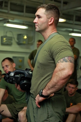 Sergeant Ryan T. Sotelo, section leader, Weapons Company, Battalion Landing Team 3/5, 15th Marine Expeditionary Unit, listens during a class on chemical, biological, radiological and nuclear defense, aboard the USS Peleliu, Oct. 4. The 15th MEU?s CBRN Defense Platoon is spending an entire month preparing the 2,400 servicemembers that make up the MEU on how to properly operate in contaminated environments. The 15th MEU is currently embarked as part of the Peleliu Amphibious Ready Group, while they serve as the nation's rapid-response sea-based Marine Air Ground Task Force for Western Pacific Deployment 12-02. Sotelo, 30, is from San Mateo, Calif.