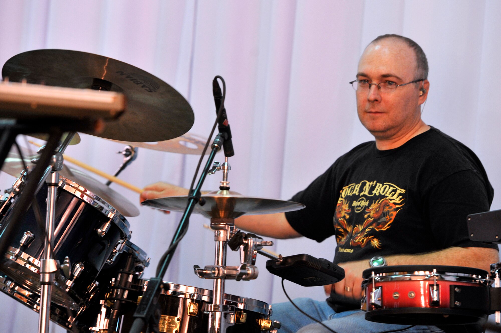 Tech. Sgt. Chad Newman plays the drums during a U.S. Air Forces Central Band "Top Flight" performance at the House of Youth, Naryn Province, Kyrgyzstan. Newman who is a percussionist is deployed from Joint Base San Antonio and a native of Arlington, Texas. The band performed for more than 800 Kyrgyz residents in Naryn while on a four-day U.S. Embassy led tour of the region. (U.S. Air Force photo/Master Sgt. Jason Vaught) 