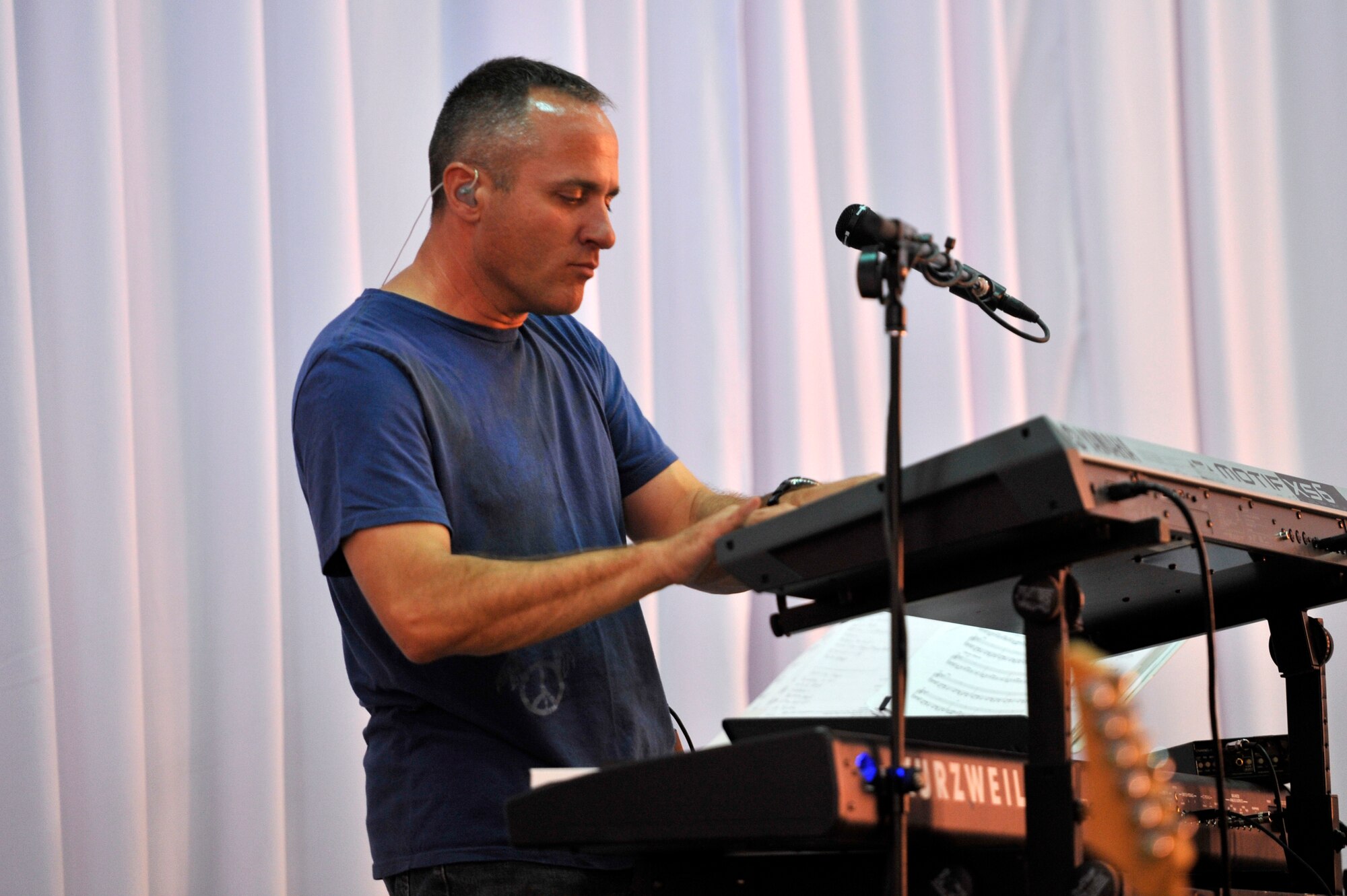 Master Sgt. Darrin Dziergowski plays the keyboard during a U.S. Air Forces Central Band "Top Flight" performance at the House of Youth, Naryn Province, Kyrgyzstan. Dziergowski is deployed from Joint Base San Antonio and a native of Suitland, Md. The band performed for more than 800 Kyrgyz residents in Naryn while on a four-day U.S. Embassy led tour of the region. (U.S. Air Force photo/Master Sgt. Jason Vaught)