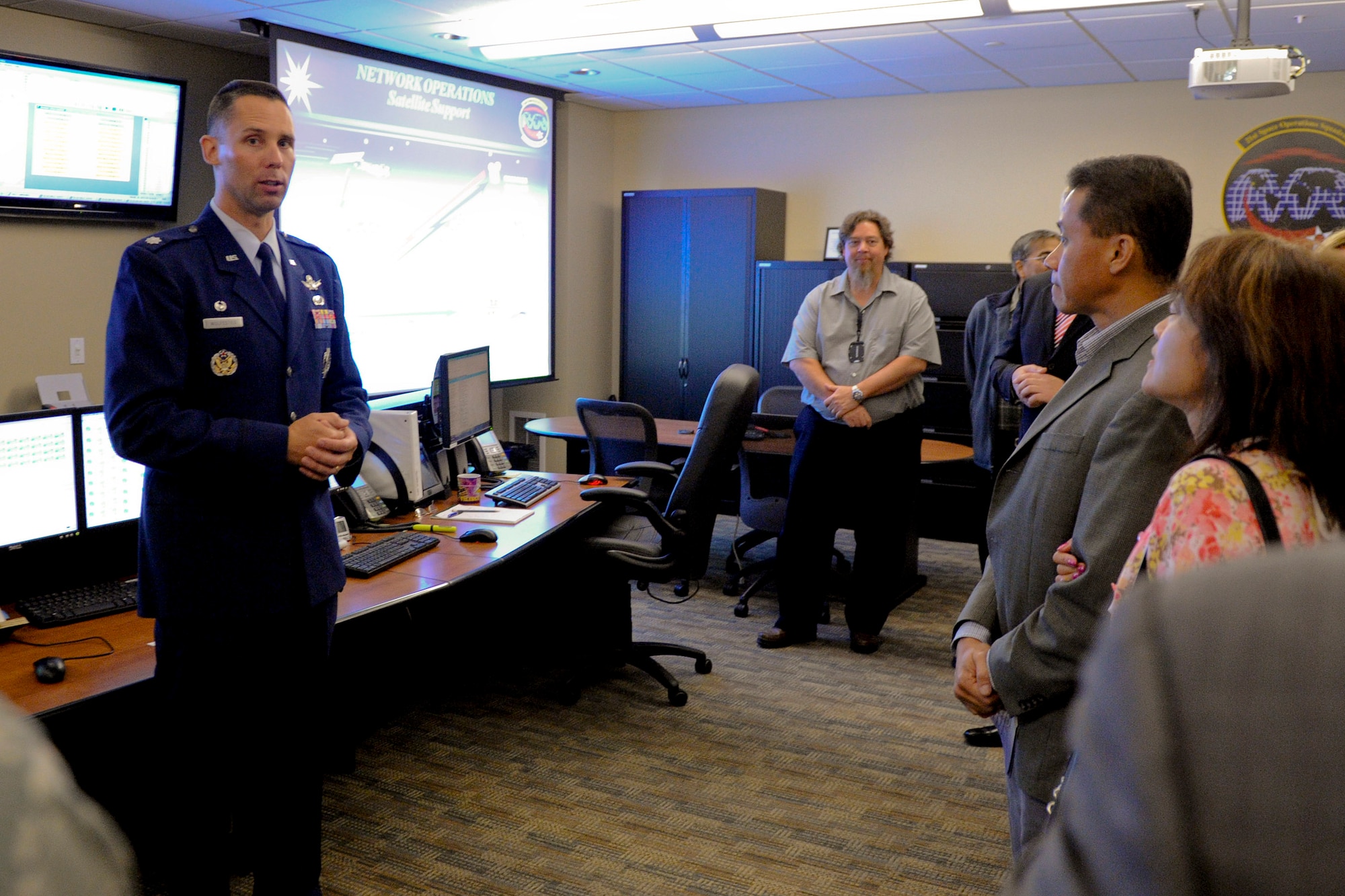 VANDENBERG AIR FORCE BASE, Calif. - Lt. Col. Michael Wulfestieg, 21st Space Operations Squadron commander, gives a tour of the 21 SOPS complex during a birthday celebration for the squadron here, Friday, Oct. 5, 2012. Active since 1991, the 21 SOPS handles the day-to-day operation and maintenance of the Air Force Satellite Control Network as well as ground antennas and monitoring stations. (U.S. Air Force photo/Staff Sgt. Levi Riendeau)
