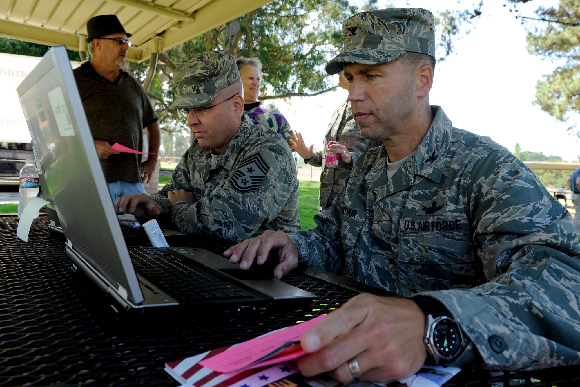 VANDENBERG AIR FORCE BASE, Calif. --  Col. Brent McArthur, 30th Space Wing vice commander, donates to his favorite charity online during the Combined Federal Campaign Kickoff Barbecue at Cocheo Park here Thursday, Oct. 4, 2012. The barbeque signaled the start of this year's CFC with organizational displays, a rock climbing wall and a human foosball court. The CFC runs until Nov. 12 at Vandenberg and is open to all military and civilian DOD employees. Interested contributors should contact their unit representative for more information or visit https://www.cfcnexus.org/_cfcgoldcoast to donate online until Dec 15. (U.S. Air Force photo/Staff Sgt. Levi Riendeau)