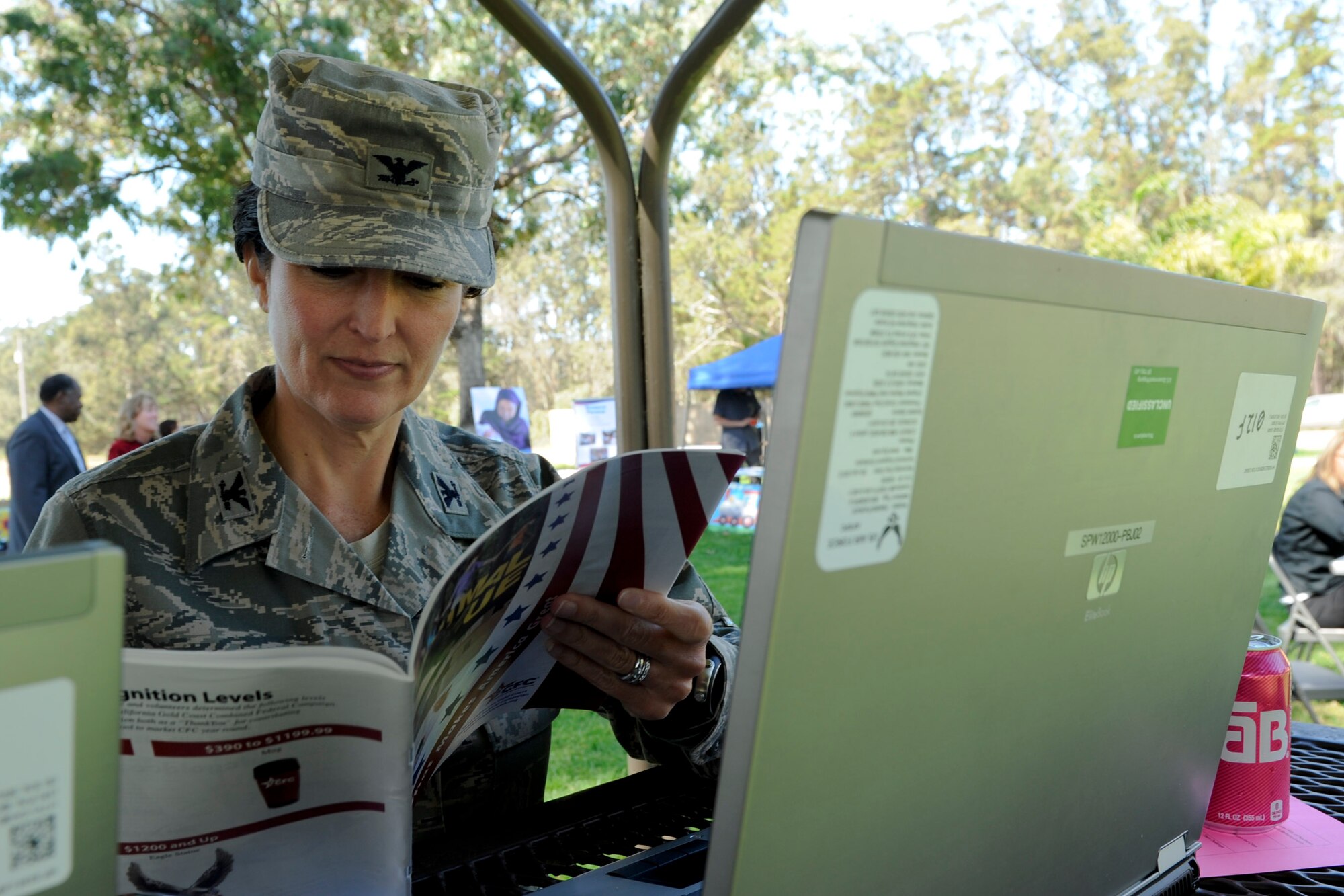 VANDENBERG AIR FORCE BASE, Calif. -- Col. Nina Armagno, 30th Space Wing commander, donates to her favorite charity online during the Combined Federal Campaign Kickoff Barbecue at Cocheo Park here Thursday, Oct. 4, 2012. The barbeque signaled the start of this year's CFC with organizational displays, a rock climbing wall and a human foosball court. The CFC runs until Nov. 12 at Vandenberg and is open to all military and civilian DOD employees. Interested contributors should contact their unit representative for more information or visit https://www.cfcnexus.org/_cfcgoldcoast to donate online until Dec. 15.  (U.S. Air Force photo/Staff Sgt. Levi Riendeau)
