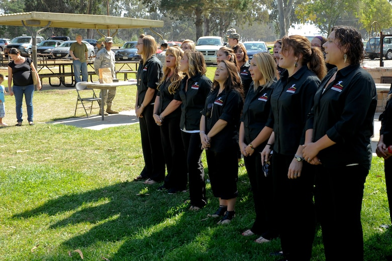 VANDENBERG AIR FORCE BASE, Calif. -- A choir from Teen Challenge sings a song during the Combined Federal Campaigns barbeque at Cocheo Park here Thursday, Oct., 4, 2012. The barbeque signaled the start of this year's CFC with organizational displays, a rock climbing wall and a human foosball court. The CFC runs until Nov. 12 at Vandenberg and is open to all military and civilian DOD employees. Interested contributors should contact their unit representative for more information or visit https://www.cfcnexus.org/_cfcgoldcoast to donate online until Dec. 15. (U.S. Air Force photo/Staff Sgt. Levi Riendeau)