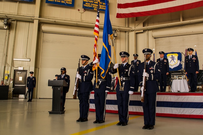 Members of the Joint Base Charleston - Air Base Honor Guard present the colors  during the 437th Airlift Wing change of command ceremony Oct. 5, 2012, in Nose Dock 2 at JB Charleston - Air Base, S.C. Col. Darren Hartford took command of the 437th AW from Col. Erik Hansen who is scheduled to transfer to Headquarters U.S. Africa Command in Stuttgart, Germany. (U.S. Air Force photo/Airman 1st Class George Goslin) 