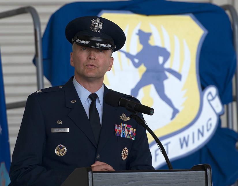 Col. Darren Hartford addresses members of the 437th Airlift Wing and invited guests for his first time as the new commander of the 437th AW Oct. 5, 2012, in Nose Dock 2 at Joint Base Charleston - Air Base, S.C. (U.S. Air Force photo/Staff Sgt. Rasheen Douglas)