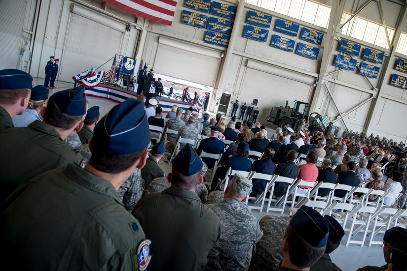 Members of the 437th Airlift Wing and invited guests watch as the 437th AW changes command Oct. 5, 2012, in Nose Dock 2 at Joint Base Charleston –  Air Base, S.C. The time-honored change of command ceremony officially marked the passing of command of the 437th AW to Col. Darren Hartford. (U.S. Air Force photo/Staff Sgt. Rasheen Douglas)