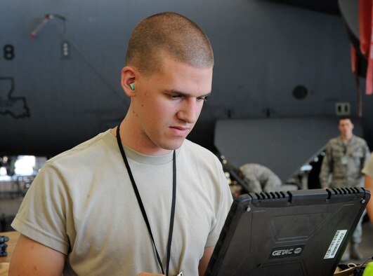 Airman 1st Class Johnathan Martin, 2nd Maintenance Squadron accessories flight electrical and environmental section, looks over phase work cards on Barksdale Air Force Base, La., Oct. 4. Before each shift, Airmen go through the workcenter turn-over log and phase cards to see what the previous shift did and what still needs to be completed. (U.S. Air Force photo/Airman 1st Class Andrew Moua)(RELEASED) 

