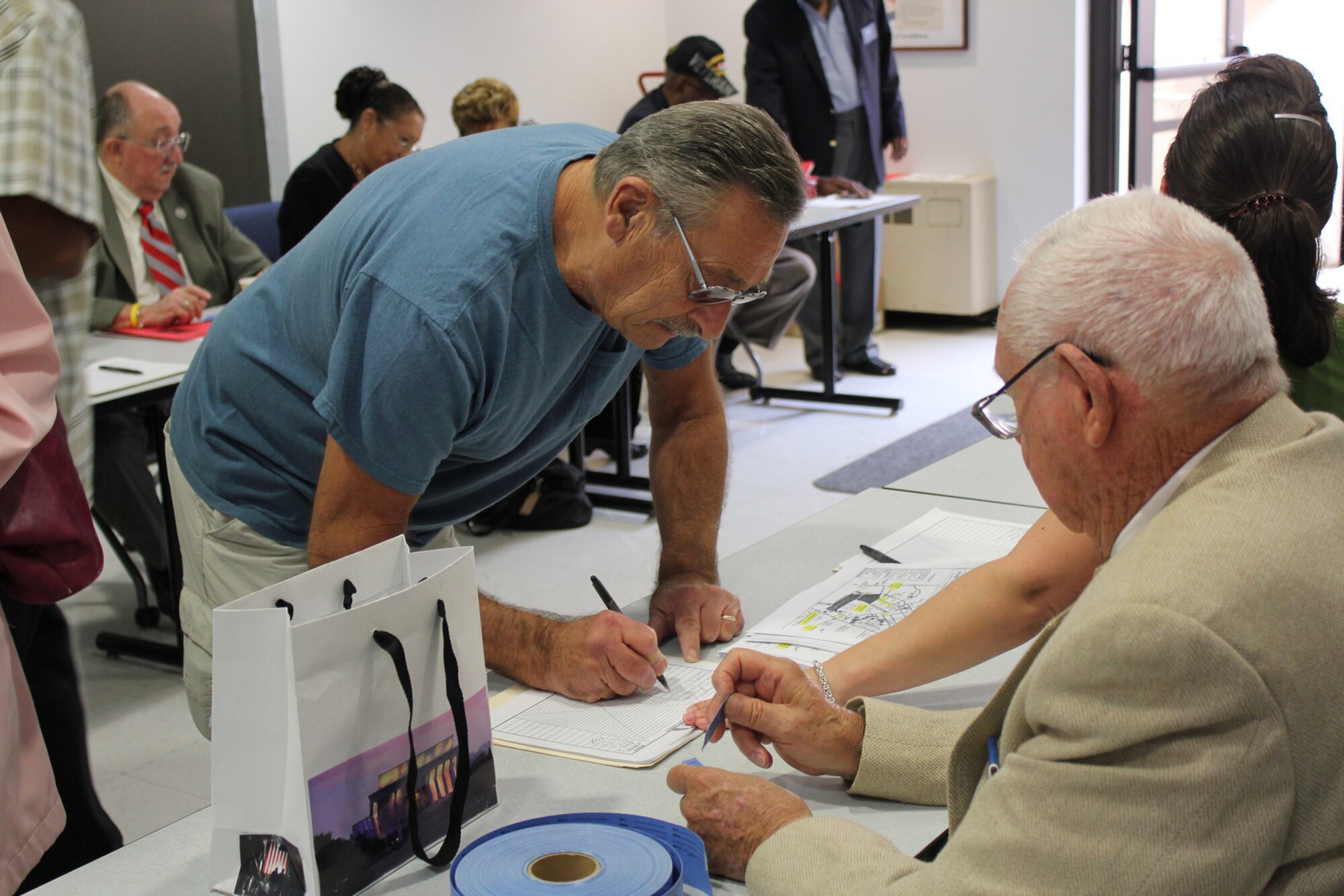 A retiree signs in the 2012 Army Support Activity Retiree Appreciation Day Sept. 29 in the Timmermann Center here. Retiree service members recieved information about different programs and benefits availble to them.

(Photo by Judy Jordan/released)