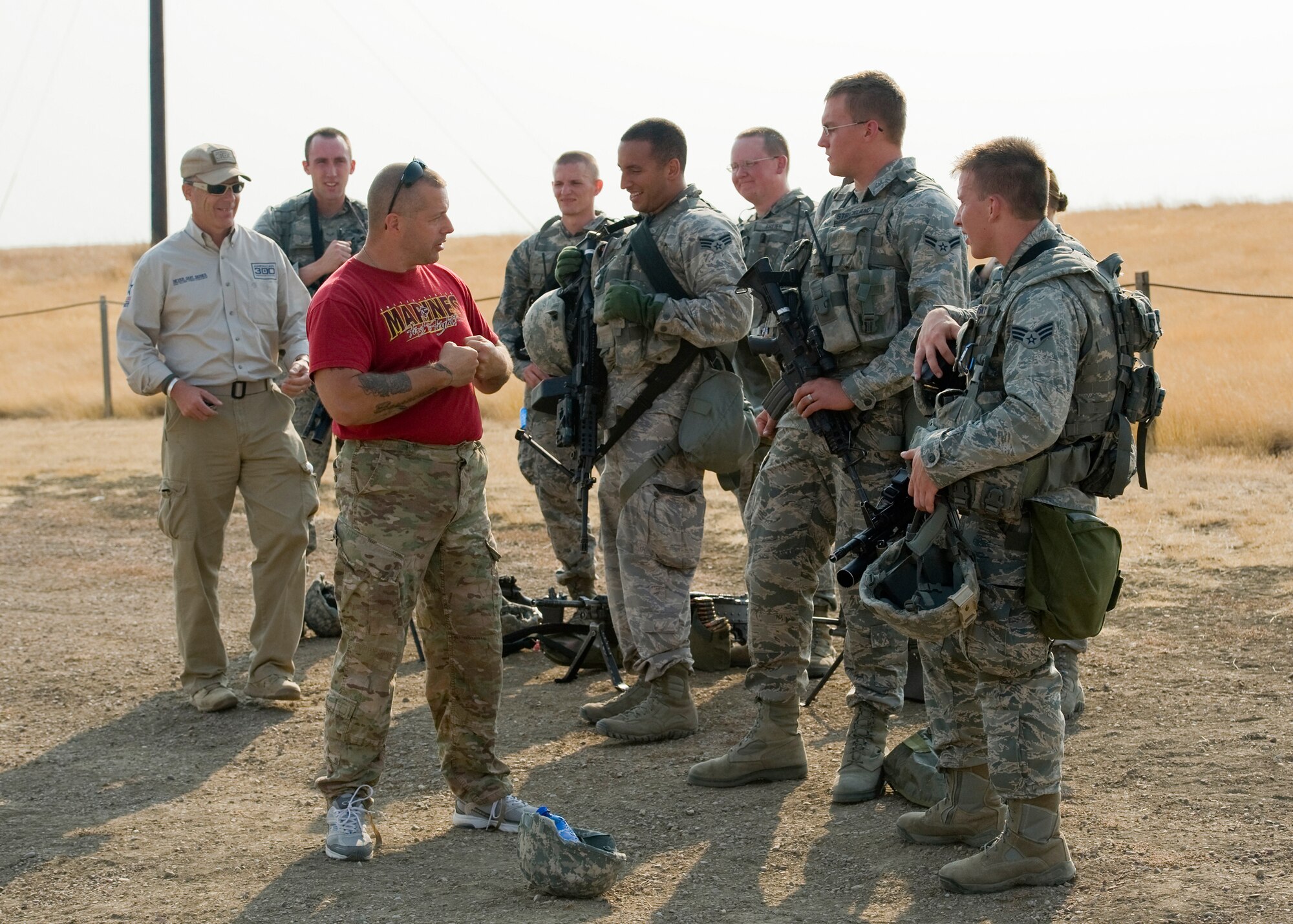 Robi Powers, American300 Warrior Tours founder, far left, and Daniel Gilyeat, retired U.S. Marine Corps staff sergeant, speak to members of the 341st Missile Security Forces Squadron about Gilyeat’s time spent as a Marine and the hardships he faced after losing his leg in 2005. (U.S. Air Force photo/Beau Wade)