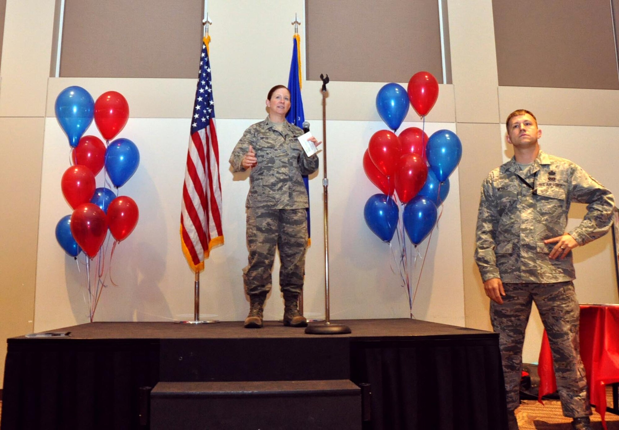 BUCKLEY AIR FORCE BASE, Colo. – Col. Tracey Hayes, 460th Space Wing vice commander, thanks Team Buckley members and representatives of approximately 70 charities for attending the Buckley Combined Federal Campaign kick-off event while Master Sgt. Bradley Moses, 460th Security Forces Squadron first sergeant and CFC volunteer, stands by Oct. 4, 2012, at the Leadership Development Center. The CFC is scheduled to run through Nov. 22 with goals to reach 100-percent contact and 30-percent participation. (U.S. Air Force photo by Staff Sgt. Kali L. Gradishar)