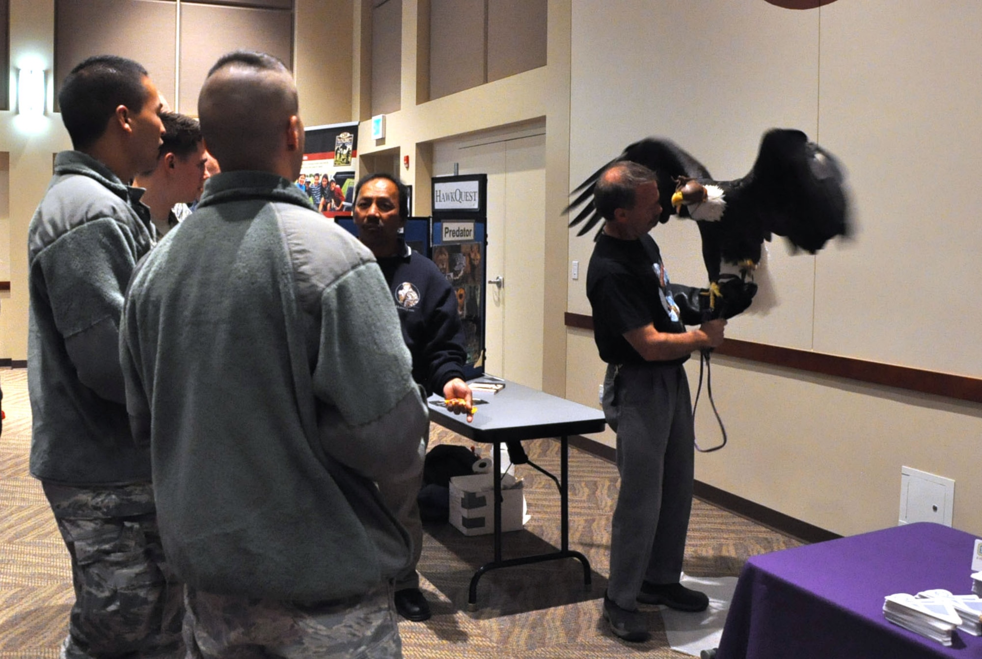 BUCKLEY AIR FORCE BASE, Colo. – Team Buckley members listen as a representative from HawkQuest discusses his organization’s mission during the Buckley Combined Federal Campaign kick-off event Oct. 4, 2012, at the Leadership Development Center. Representatives from approximately 70 charities operated booths to encourage people to donate to their respective organizations. (U.S. Air Force photo by Staff Sgt. Kali L. Gradishar)