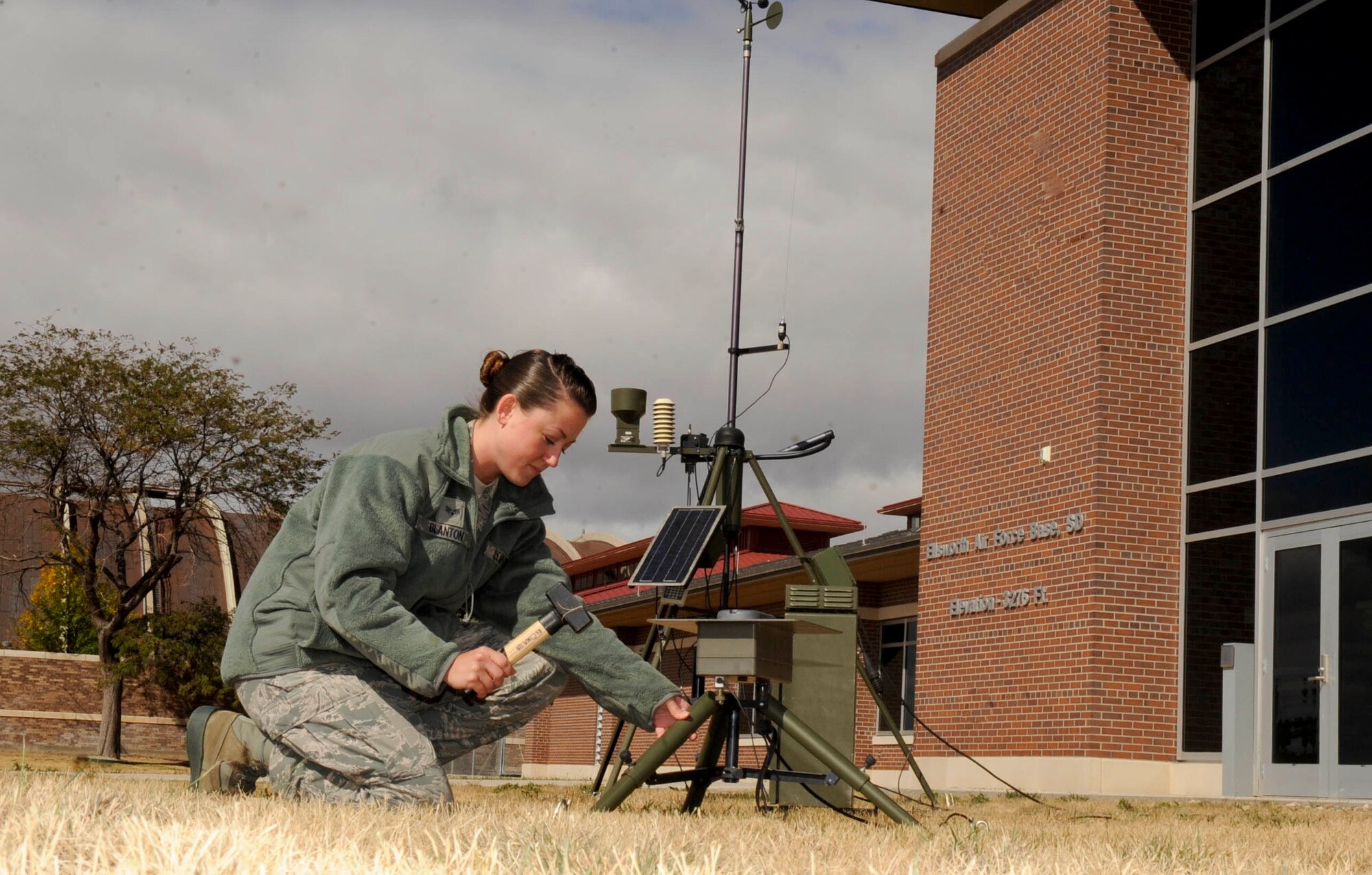 Senior Airman Nicole Blanton, 28th Operations Support Squadron weather forcaster, installs a lightning detector on the tactical meteorological observing system at Ellsworth Air Force Base, S.D., Oct. 4, 2012. The lightning detector can record lightning strikes within a 50 mile radius, allowing weather forcasters to provide accurate weather forecasts, which fosters the safety of base personnel. (U.S. Air Force photo by Airman 1st Class Anania Tekurio/Released)