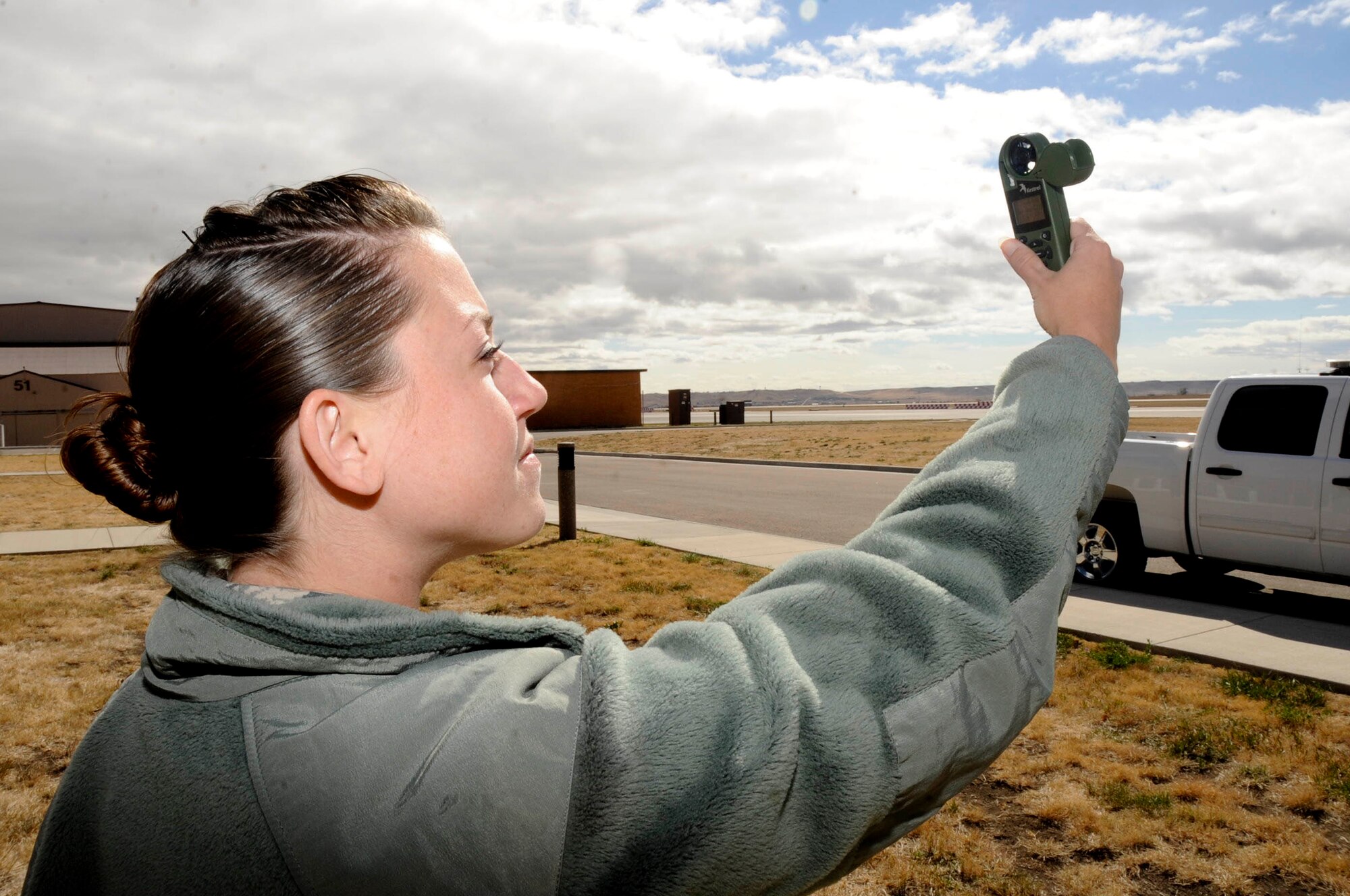 Senior Airman Nicole Blanton, 28th Operations Support Squadron weather forcaster, operates an instrument to record local weather conditions at Ellsworth Air Force Base, S.D., Oct. 4, 2012. The device provides accurate temperature, dew point, humidity and windspeed measurements that assist Airmen as they forecast weather conditions. (U.S. Air Force photo by Airman 1st Class Anania Tekurio/Released) 