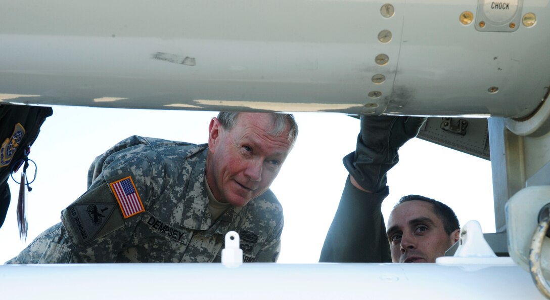 Capt. Brian Willis, 4th Airlift Squadron, describes the features of a load training device to Army Gen. Martin Dempsey, chairman of the Joint Chiefs of Staff, Oct. 4, 2012, at Joint Base Lewis-McChord, Wash. Dempsey completed his four-day visit to the Seattle and Tacoma area with several briefings and a small tour of McChord Field. (U.S. Air Force photo/Staff Sgt. Sean Tobin)